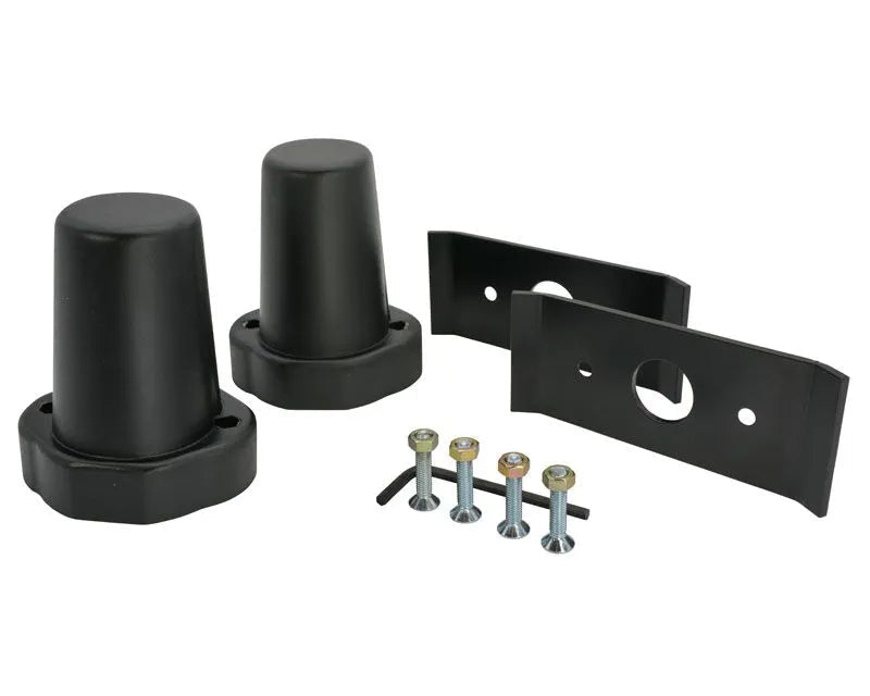 Two black extended bump stops with standard mounting plates and hardware pack for Toyota Tacoma.